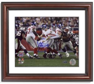 Eli Manning Signed, Framed Escaping Tackle Photo